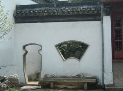 031 Fan and Vase openings in wall at House of Prosperity Tong.JPG
